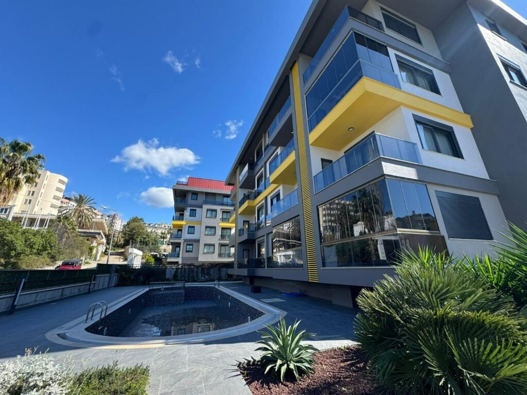 A stylish apartment with a pool view and the complex's well-developed infrastructure