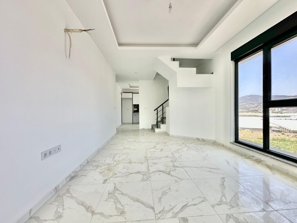 For sale: a cozy 2+1 duplex with sea and mountain views, 250 meters from the beach in Demirtaş