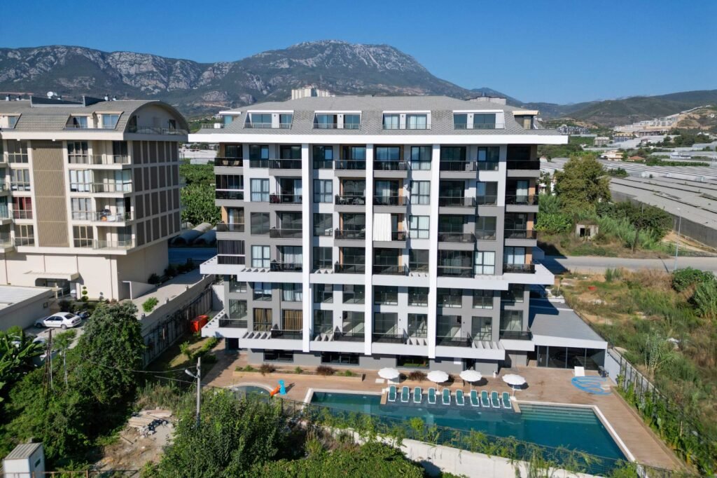 Fully finished 1+1 apartment for sale with sea and mountain views in Kargicak at a great price